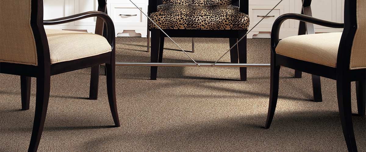 neutral carpet in dinning room with leopard chairs 